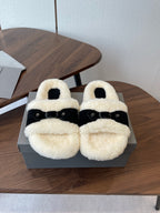 Balenciaga shearling sandals with black straps and cream fuzzy footbed, pair on box