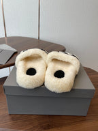 Balenciaga teddy slide sandals with cream fuzzy uppers and black footbeds, pair on box