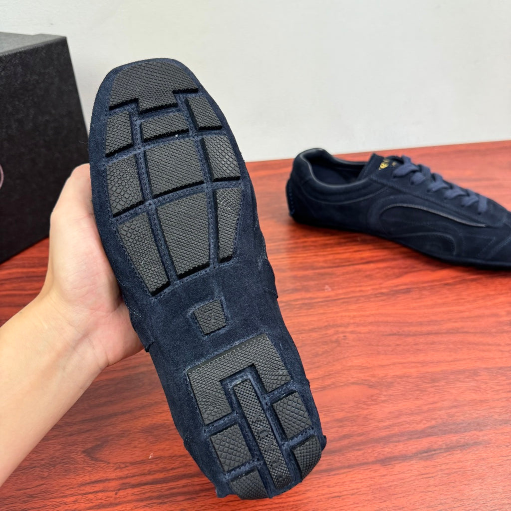 Navy Prada sneaker outsole with grid tread pattern and raised traction blocks