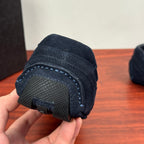 Navy suede Prada sneaker toe and outsole detail with textured rubber tread
