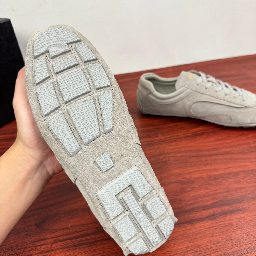 Light gray sneaker outsole with grid pattern and tread blocks