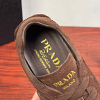 Brown suede sneaker showing interior PRADA label and brand text
