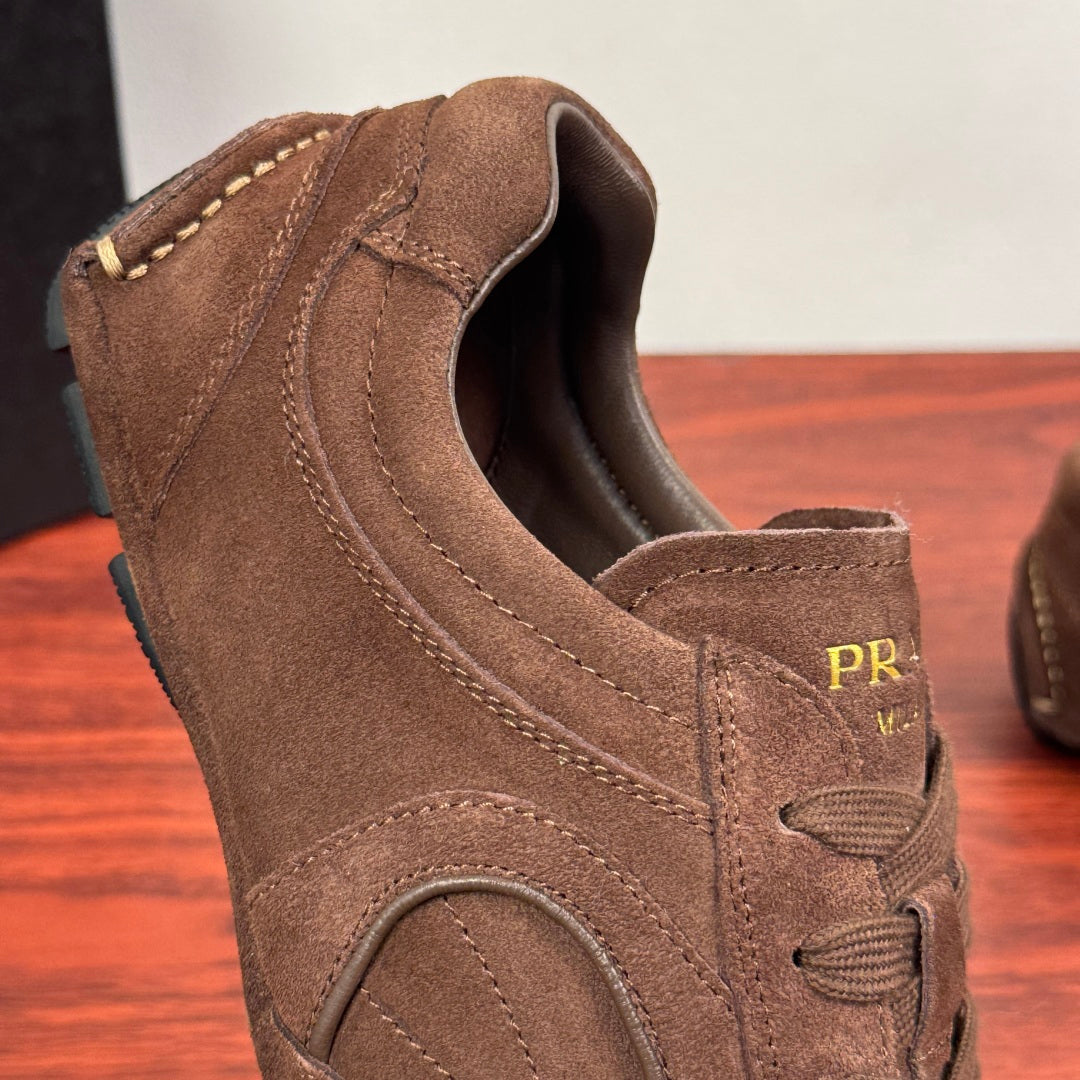 Brown suede sneaker heel with PRADA logo label on padded collar