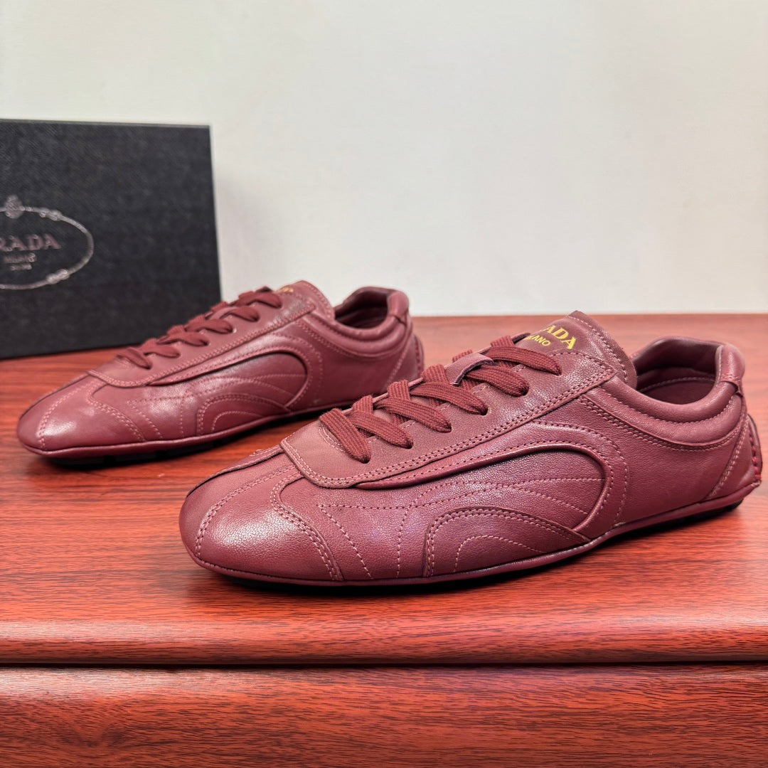 Prada unisex leather sneakers, burgundy, lace-up with sculpted toe and side panels