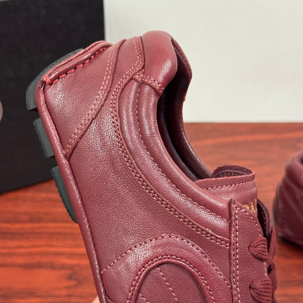 Prada unisex leather sneaker burgundy, close-up heel collar and seam lines