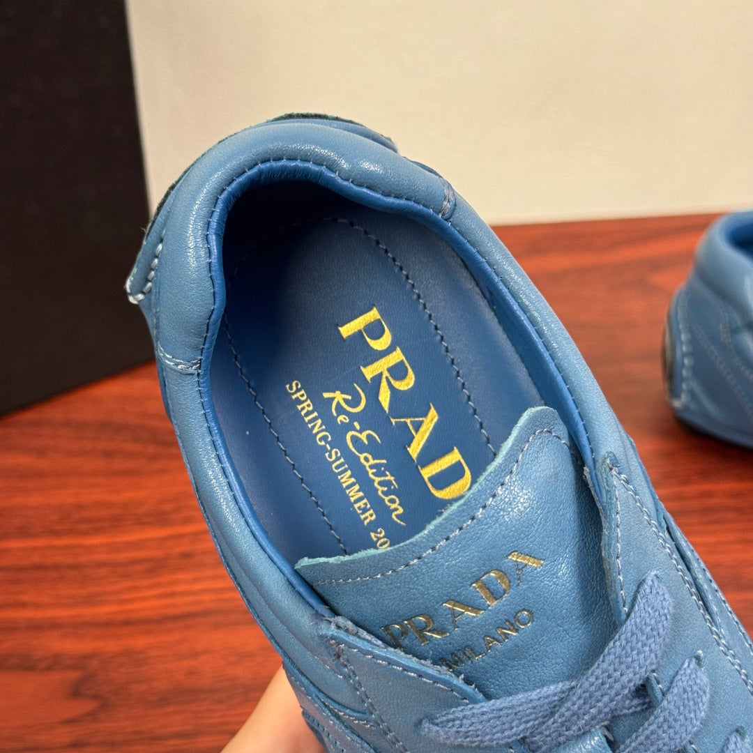 Light blue unisex sneaker interior with PRADA logo on the insole