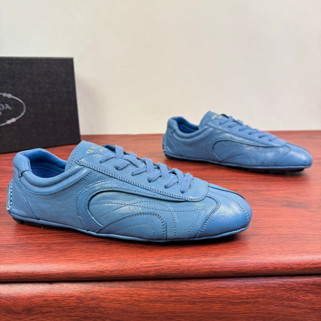 Prada unisex sneakers in light blue with lace-up front and textured side panel