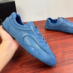 Light blue unisex sneakers shown from side, with lace-up and padded collar