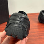 Prada unisex sneakers, close-up of toe guard, dark textured rubber and stitch trim