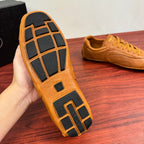 Tan sneaker outsole with dark tread grid pattern and block details