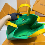 Louis Vuitton green bag with bright yellow handles and straps, open top