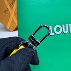 Louis Vuitton green bag with silver D-ring and yellow strap accent
