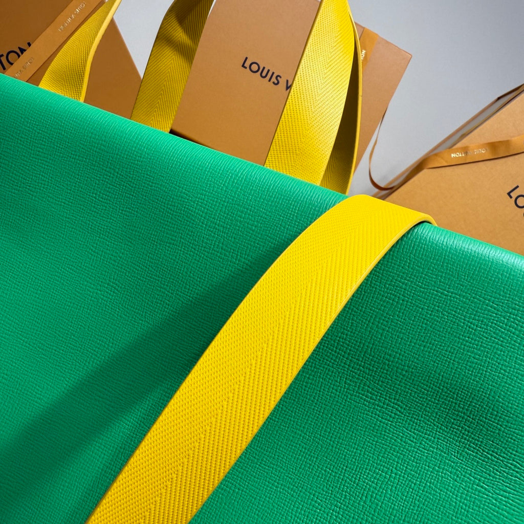 Louis Vuitton green tote bag with yellow strap close-up
