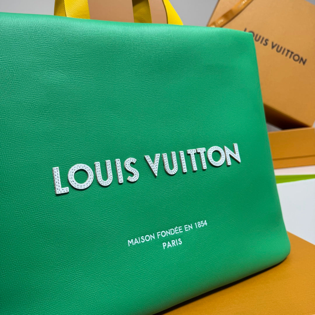 Louis Vuitton logo on green tote bag with smaller brand text below