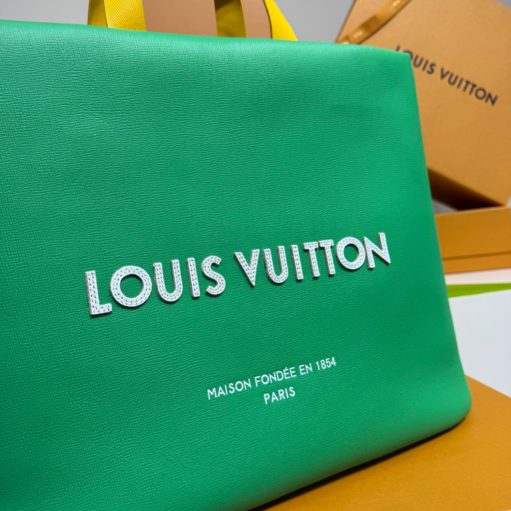Louis Vuitton green tote bag close-up of front logo and Maison Founded text