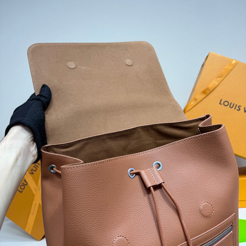 Men’s Louis Vuitton backpack top opening view with drawstring cords and metal eyelets