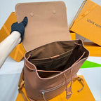 Men’s Louis Vuitton leather bucket bag with drawstring cords and front zip pocket