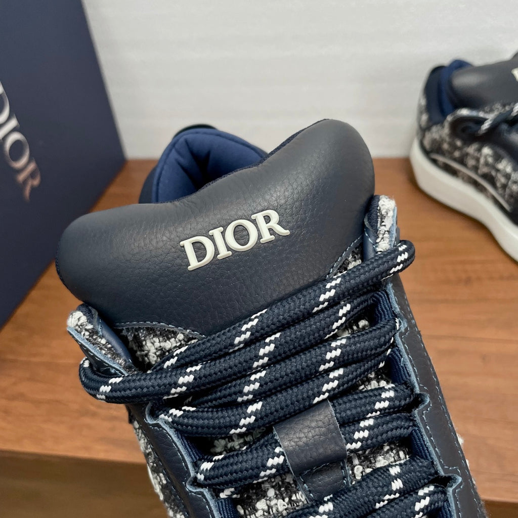 Unisex sneaker side view, DIOR on dark tongue, navy and silver speckled upper
