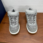 Light gray low-top sneakers with lace-up closure and Dior logo on tongue