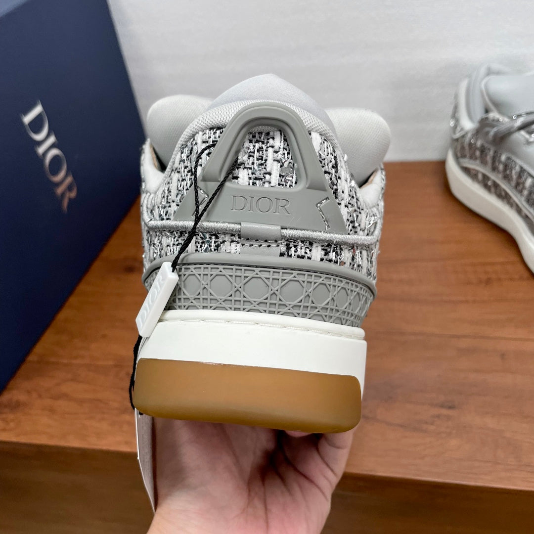 Light gray sneaker heel with Dior logo patch and textured woven upper
