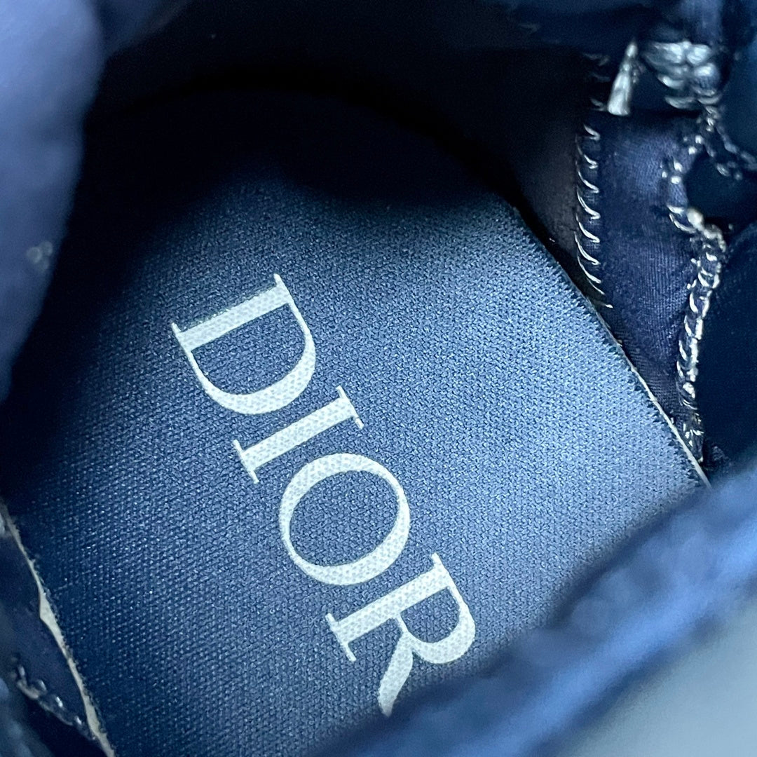 Unisex Dior insole label, blue fabric with Dior logo print, close-up