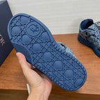 Unisex Dior sneaker outsole, blue textured traction tread, sole close-up