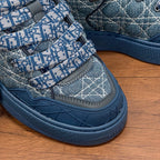 Unisex Dior sneakers, blue denim patterned uppers with Velcro strap and tread sole
