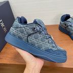 Unisex Dior sneakers, blue denim patterned upper with lace-up eyelets, close-up