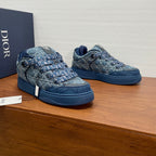 Unisex Dior sneakers, blue denim patterned fabric uppers with navy soles, side view