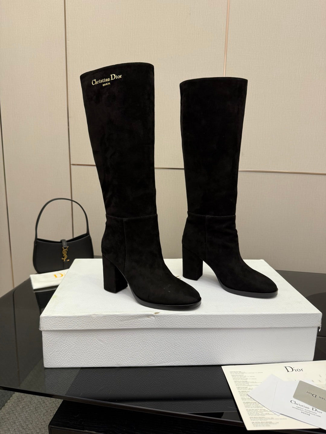 Black knee-high suede pull-on boots with block heels and rounded toe