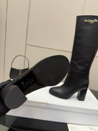 Black boot outsole and heel, textured sole, Dior knee-high boot upper