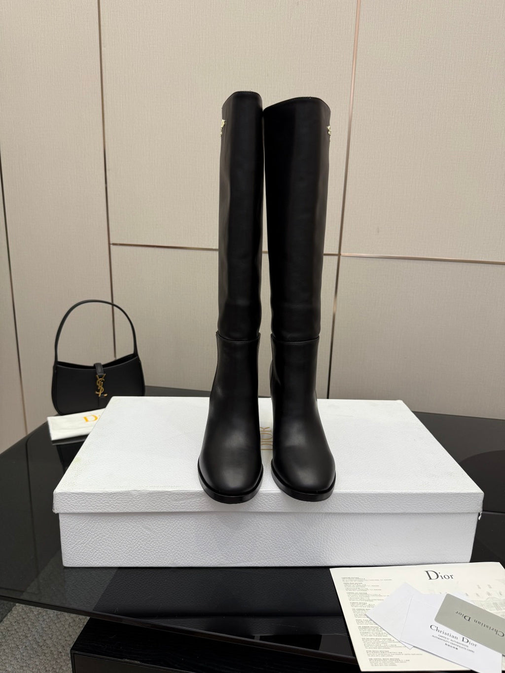 Black knee-high boots standing side by side, block heel, pull-on style, Dior logo