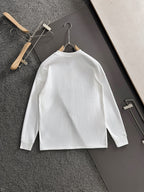 White long-sleeve shirt on hanger with FENDI logo