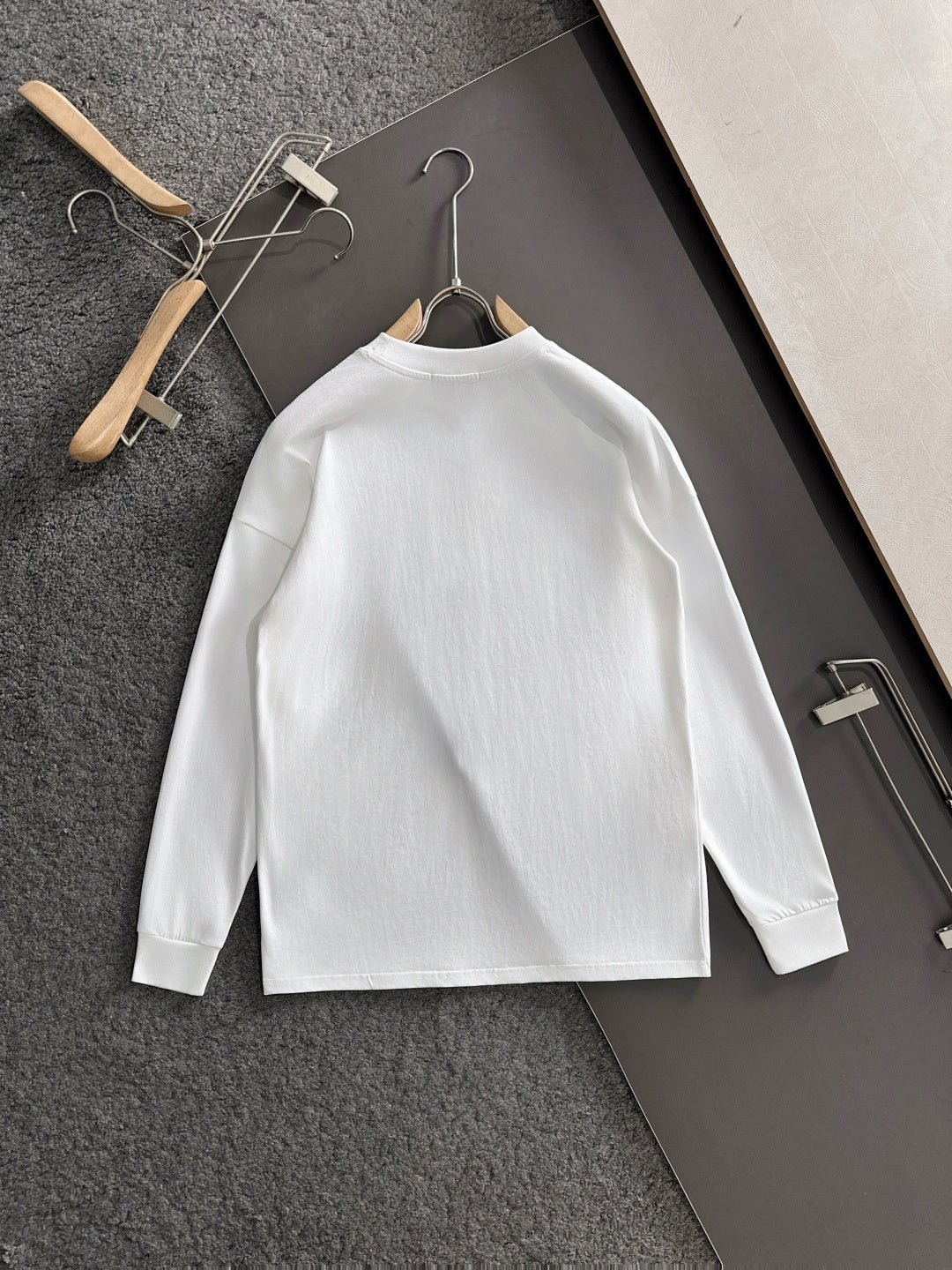 White long-sleeve shirt on hanger with FENDI logo