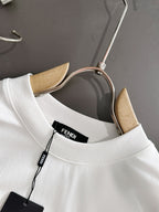 White long-sleeve shirt neckline with FENDI inner label and hanging tag