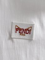 White fabric label patch with FENDI ROMA logo