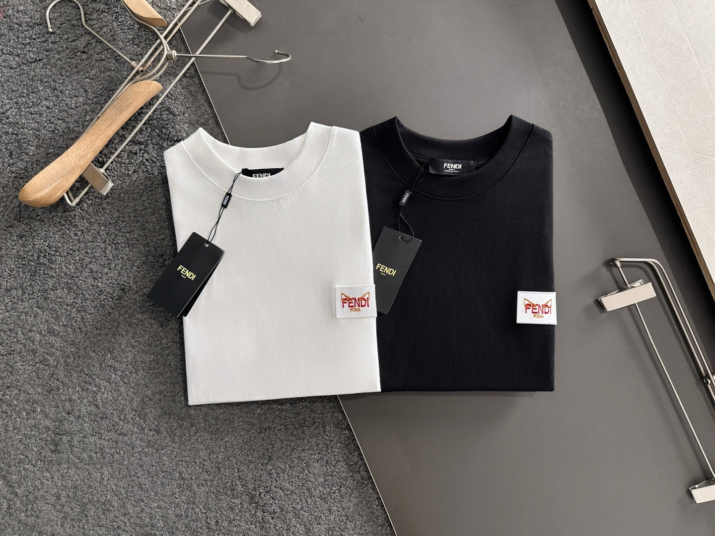 Set of white and black long-sleeve shirts with Fendi logo patches