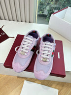 Lilac Gucci ladies sneakers pair on red shoebox, white laces and gold emblem