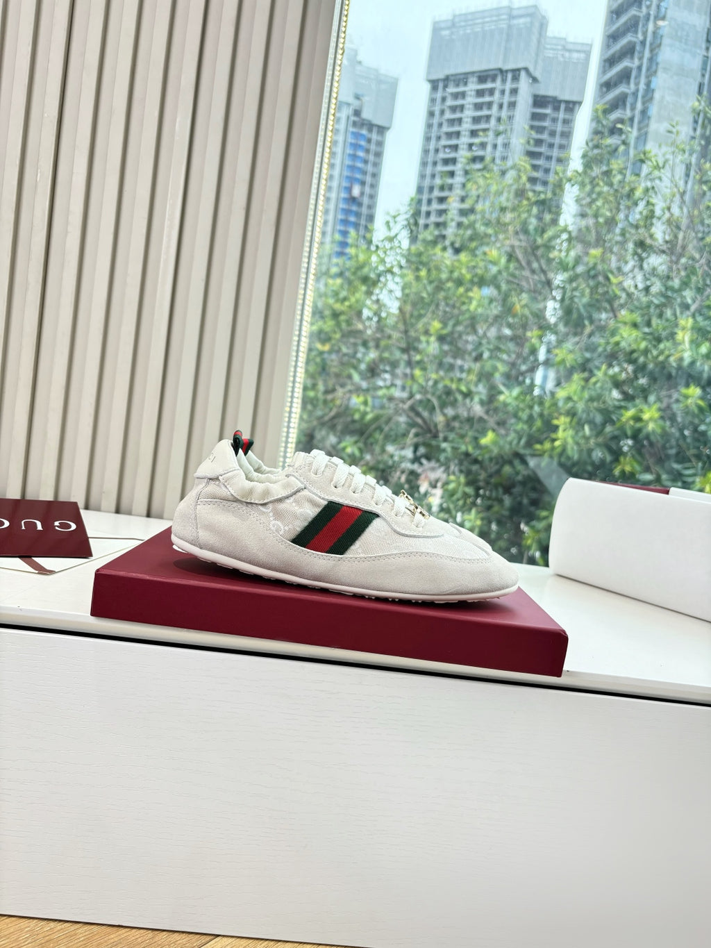 Gucci low-top sneaker, white with green-red web detail and GG-pattern side