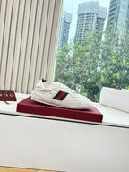 Gucci low-top sneaker, white with green-red web detail and GG-pattern side