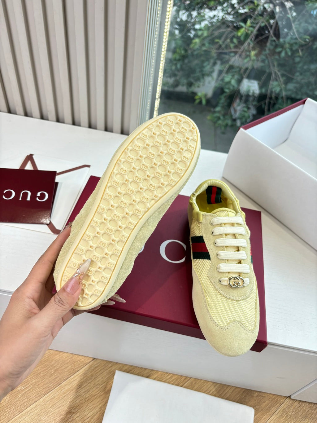 Women's yellow sneaker sole and side view with Web stripe and lace hardware