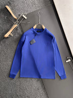 Prada long-sleeve top, blue, front view on hanger