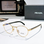 Gold round eyeglasses with black temple arms and clear lenses