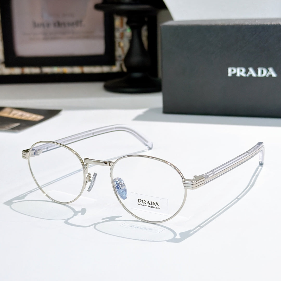 Silver round eyeglasses with light blue temple arms and clear lenses
