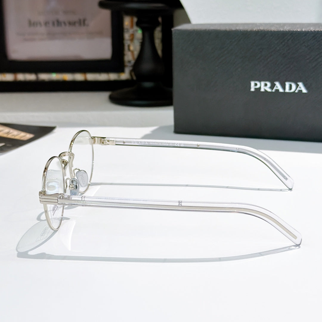 Silver round eyeglasses with clear temple arms and small logo details