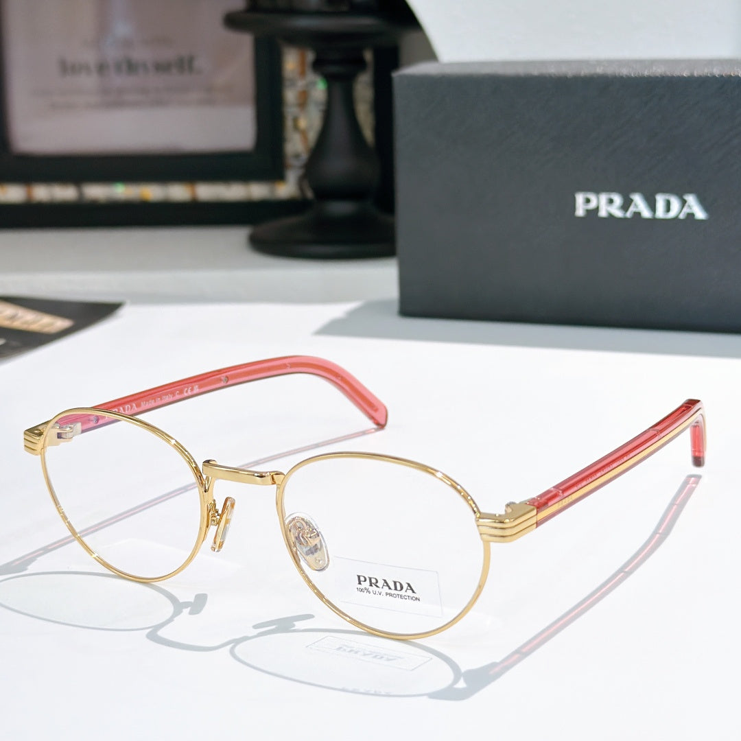Gold round eyeglasses with red temple arms and clear lenses