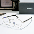 Gold round eyeglasses with gray temple arms and clear lenses