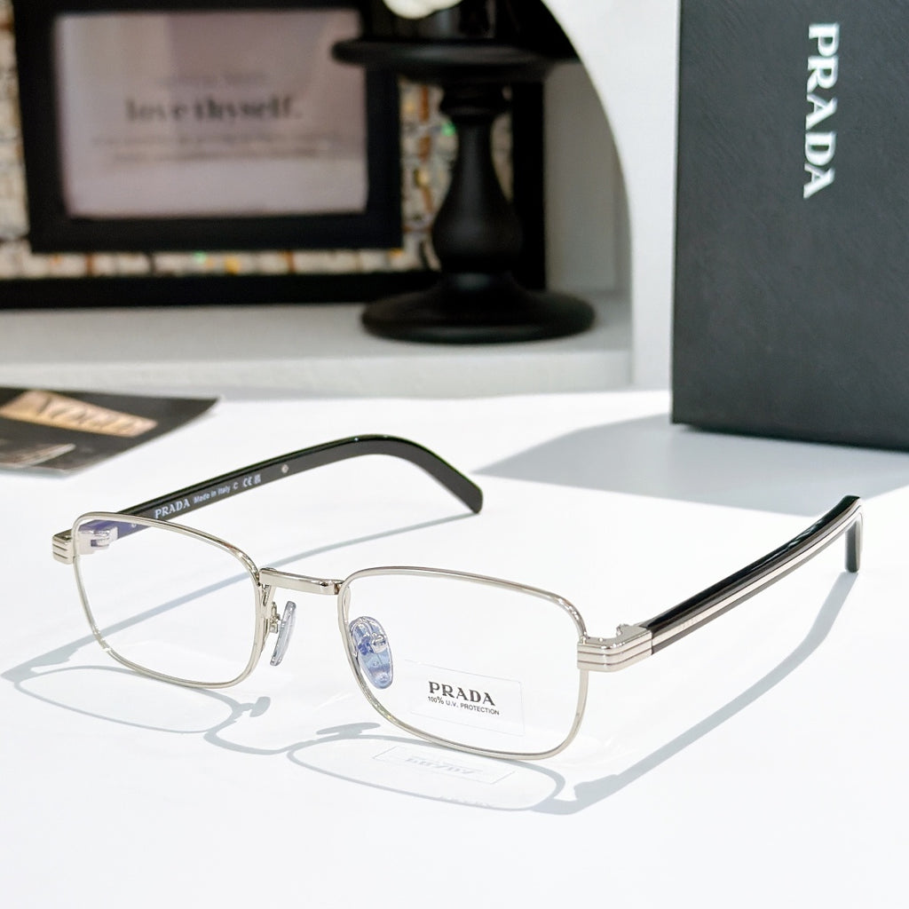 Rectangular eyeglasses with silver metal frame and dark striped temples