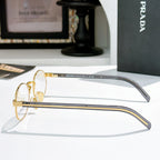 Prada eyeglasses side view with round gold frame and dark gray temples