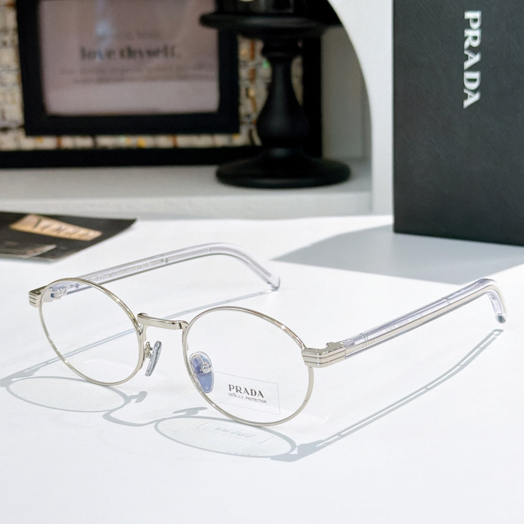 Prada eyeglasses with round silver frames and blue-tinted lenses